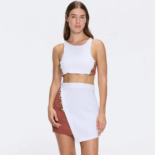 Riviera White-Brown Duo-Colored Asymmetric Gold Button Mini Skort | Moeva | Skirt | Each week unveils new pieces—luxury swimwear, fluid resort silhouettes, and elevated summer-to-evening essentials designed to carry you from coastal escapes to city nights.