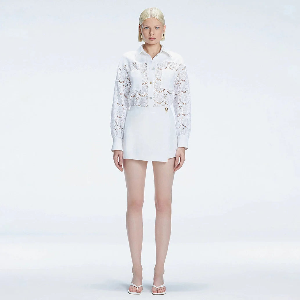 Elise White Linen Mini Skort | Moeva | Skort | Each week unveils new pieces—luxury swimwear, fluid resort silhouettes, and elevated summer-to-evening essentials designed to carry you from coastal escapes to city nights.