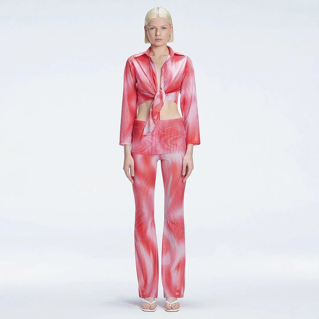 Greta Long Sleeve Tie Front Shirt and Freya High Waist Pants Red Optical Set | Moeva | Set | Each week unveils new pieces—luxury swimwear, fluid resort silhouettes, and elevated summer-to-evening essentials designed to carry you from coastal escapes to city nights.