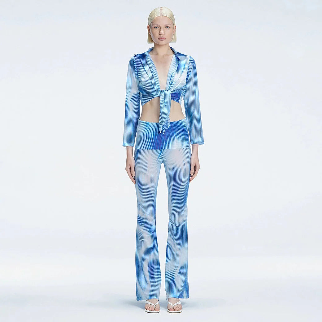 Greta Long Sleeve Tie Front Shirt and Freya High Waist Pants Blue Optical Set | Moeva | Set | Each week unveils new pieces—luxury swimwear, fluid resort silhouettes, and elevated summer-to-evening essentials designed to carry you from coastal escapes to city nights.