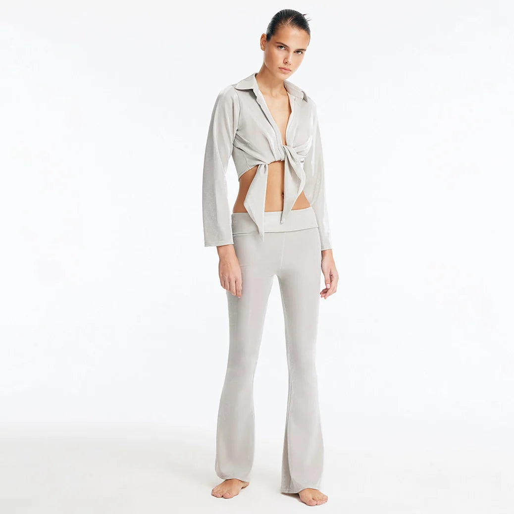 Izara Silver Mid-Rise Flared Pants | Moeva | Pants | Each week unveils new pieces—luxury swimwear, fluid resort silhouettes, and elevated summer-to-evening essentials designed to carry you from coastal escapes to city nights.