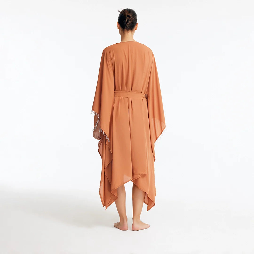 Bethany Bronze V Neck Belted Silk Kaftan | Moeva | Kaftan | Each week unveils new pieces—luxury swimwear, fluid resort silhouettes, and elevated summer-to-evening essentials designed to carry you from coastal escapes to city nights.