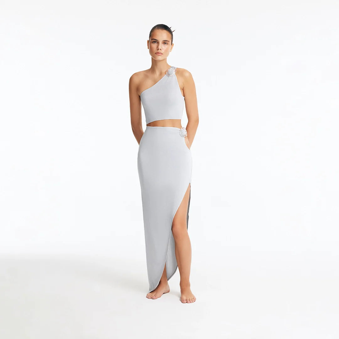 Eila Silver One Shoulder Knitted Crop Top | Moeva | Crop Top | Each week unveils new pieces—luxury swimwear, fluid resort silhouettes, and elevated summer-to-evening essentials designed to carry you from coastal escapes to city nights.