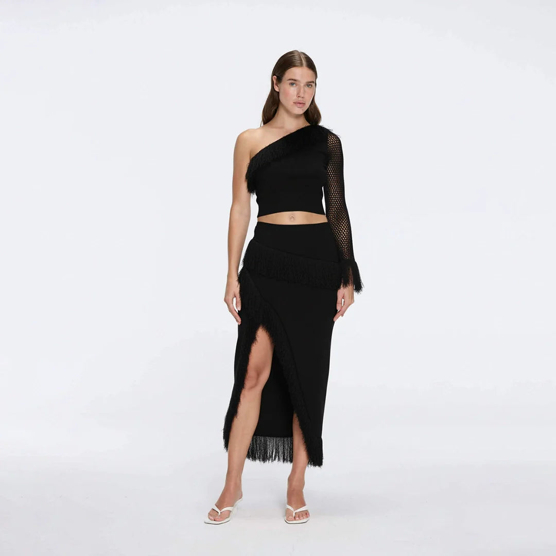 Alani Black Fringe Detail Asymmetric Slit Midi Skirt | Moeva | Skirt | Each week unveils new pieces—luxury swimwear, fluid resort silhouettes, and elevated summer-to-evening essentials designed to carry you from coastal escapes to city nights.