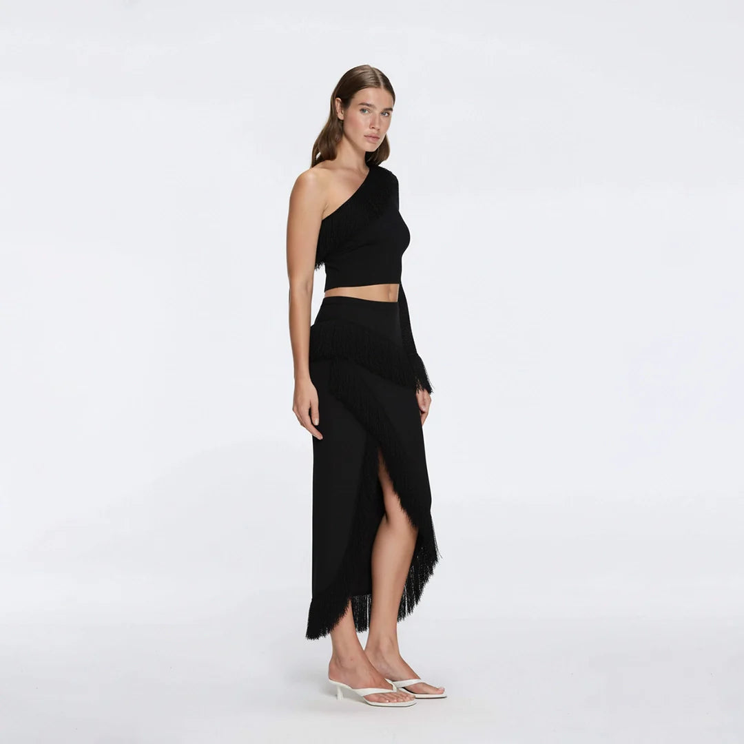 Alani Black Fringe Detail Asymmetric Slit Midi Skirt | Moeva | Skirt | Each week unveils new pieces—luxury swimwear, fluid resort silhouettes, and elevated summer-to-evening essentials designed to carry you from coastal escapes to city nights.