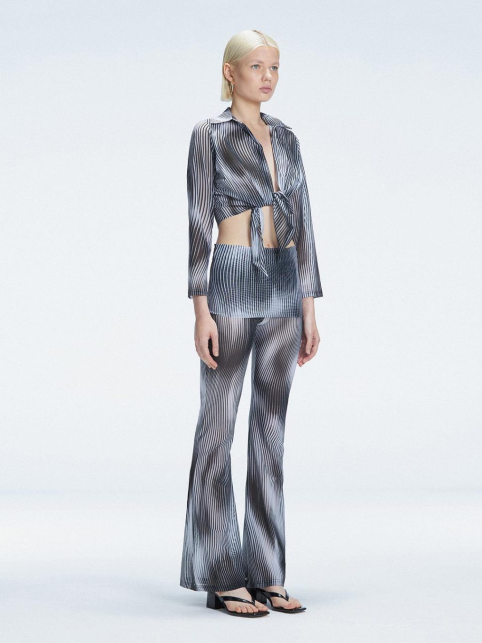 Greta Black Long Sleeve Tie Front Shirt | Moeva | Shirt | Each week unveils new pieces—luxury swimwear, fluid resort silhouettes, and elevated summer-to-evening essentials designed to carry you from coastal escapes to city nights.