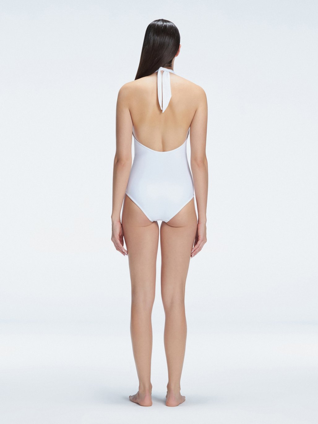 Rosamund White Halter Swimsuit | Moeva | Swimsuit | Each week unveils new pieces—luxury swimwear, fluid resort silhouettes, and elevated summer-to-evening essentials designed to carry you from coastal escapes to city nights.