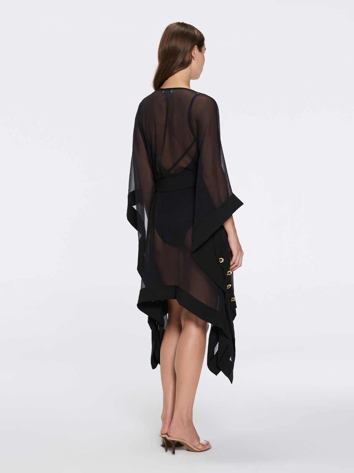 Tata Black Sheer Gold Buttoned Belted Kaftan with Asymmetric Hem | Moeva | Kaftan | Each week unveils new pieces—luxury swimwear, fluid resort silhouettes, and elevated summer-to-evening essentials designed to carry you from coastal escapes to city nights.