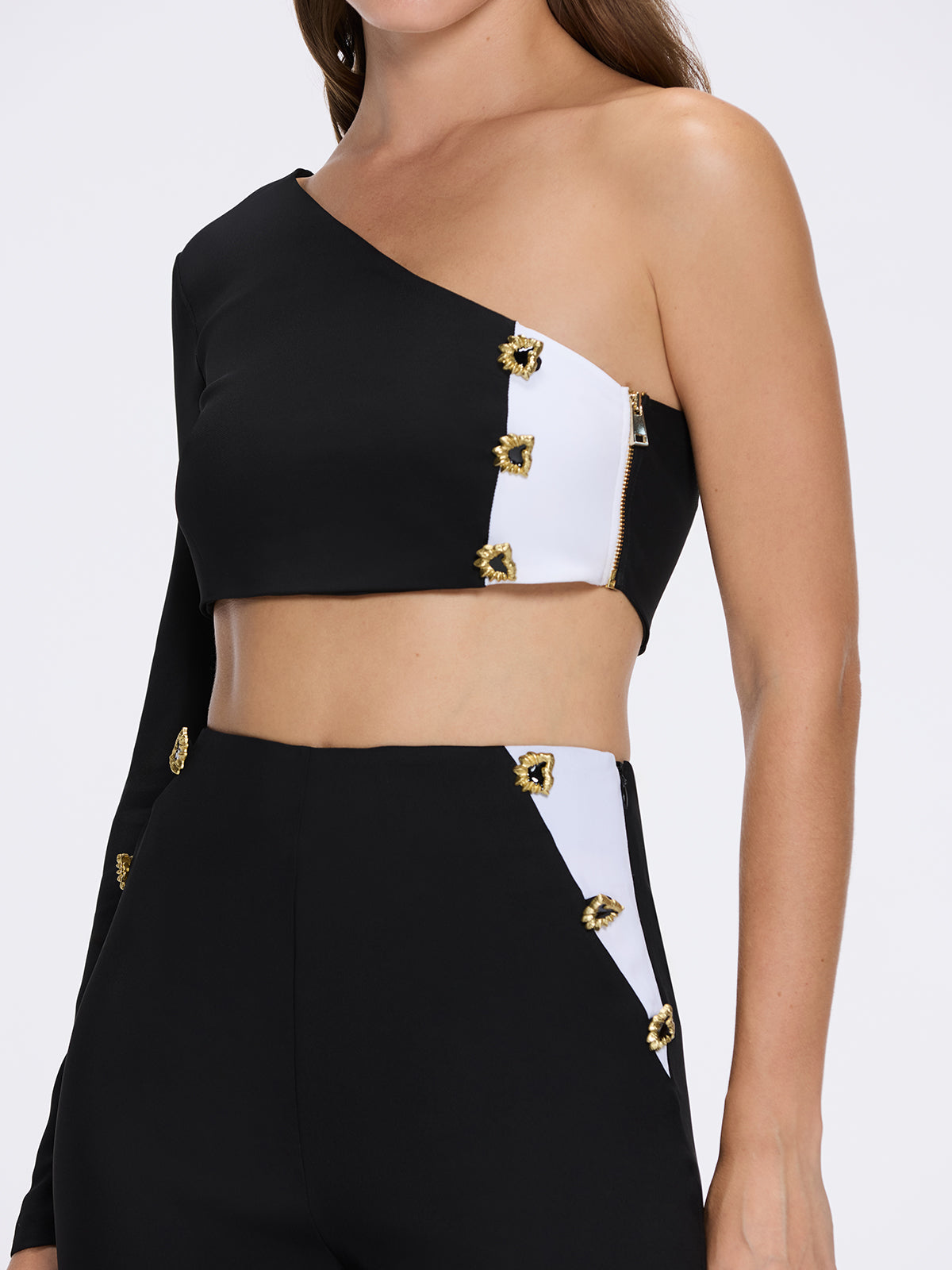 Villamar Black-White Duo-Tone Gold Button One-Shoulder Crop Top | Moeva | Crop Top | Each week unveils new pieces—luxury swimwear, fluid resort silhouettes, and elevated summer-to-evening essentials designed to carry you from coastal escapes to city nights.
