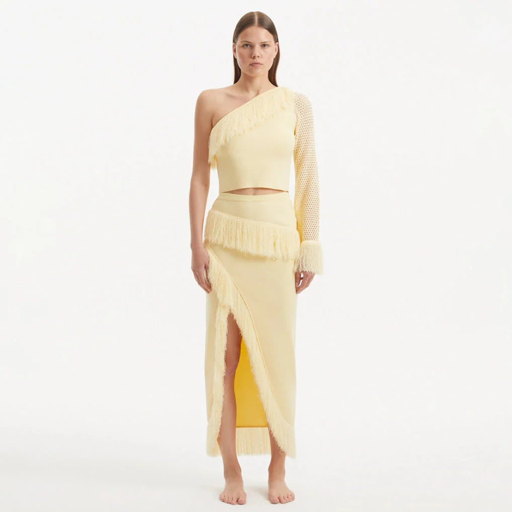 Alani Yellow Fringe Detail Asymmetric Slit Midi Skirt | Moeva | Skirt | Each week unveils new pieces—luxury swimwear, fluid resort silhouettes, and elevated summer-to-evening essentials designed to carry you from coastal escapes to city nights.