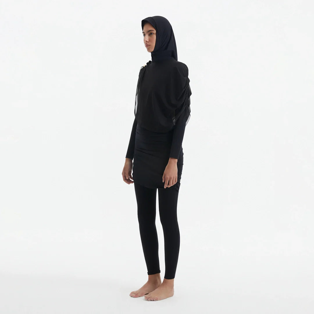 Risha Black Swim Hijab | Moeva | Turban | Each week unveils new pieces—luxury swimwear, fluid resort silhouettes, and elevated summer-to-evening essentials designed to carry you from coastal escapes to city nights.
