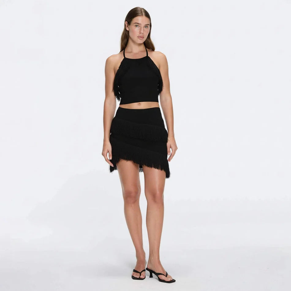 Arlo Black Fringe Detail Asymmetric Mini Skirt | Moeva | Skirt | Each week unveils new pieces—luxury swimwear, fluid resort silhouettes, and elevated summer-to-evening essentials designed to carry you from coastal escapes to city nights.