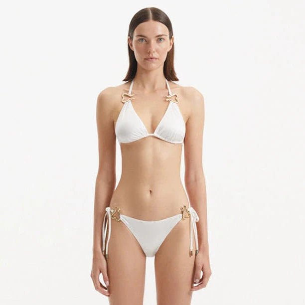 Rhea White Triangle Side Tie Satin Bikini Set | Moeva | Bikini Set | Each week unveils new pieces—luxury swimwear, fluid resort silhouettes, and elevated summer-to-evening essentials designed to carry you from coastal escapes to city nights.