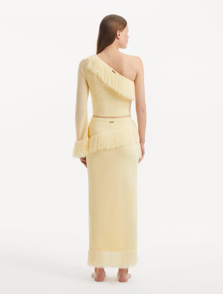 Monroe Yellow One-Shoulder Knit Top with Fringe & Mesh Sleeve | Moeva | Crop Top | Each week unveils new pieces—luxury swimwear, fluid resort silhouettes, and elevated summer-to-evening essentials designed to carry you from coastal escapes to city nights.