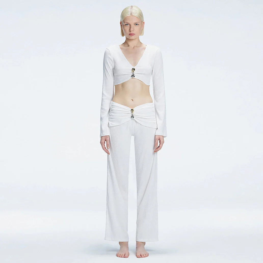 Sirenia Long Sleeve Crop Top and Helena Straight Leg Accessorised Pants White Set | Moeva | Set | Each week unveils new pieces—luxury swimwear, fluid resort silhouettes, and elevated summer-to-evening essentials designed to carry you from coastal escapes to city nights.