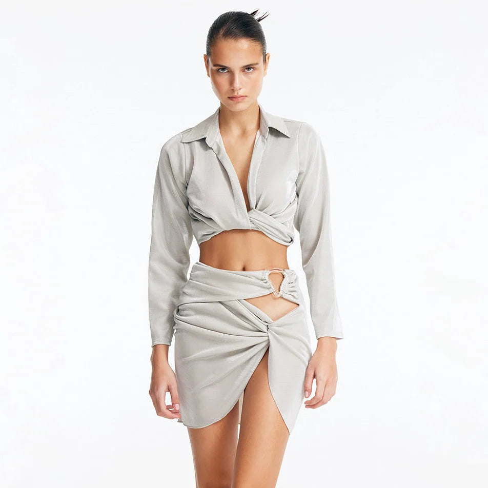 Greta Silver Long Sleeve Tie Front Shirt | Moeva | Shirt | Each week unveils new pieces—luxury swimwear, fluid resort silhouettes, and elevated summer-to-evening essentials designed to carry you from coastal escapes to city nights.