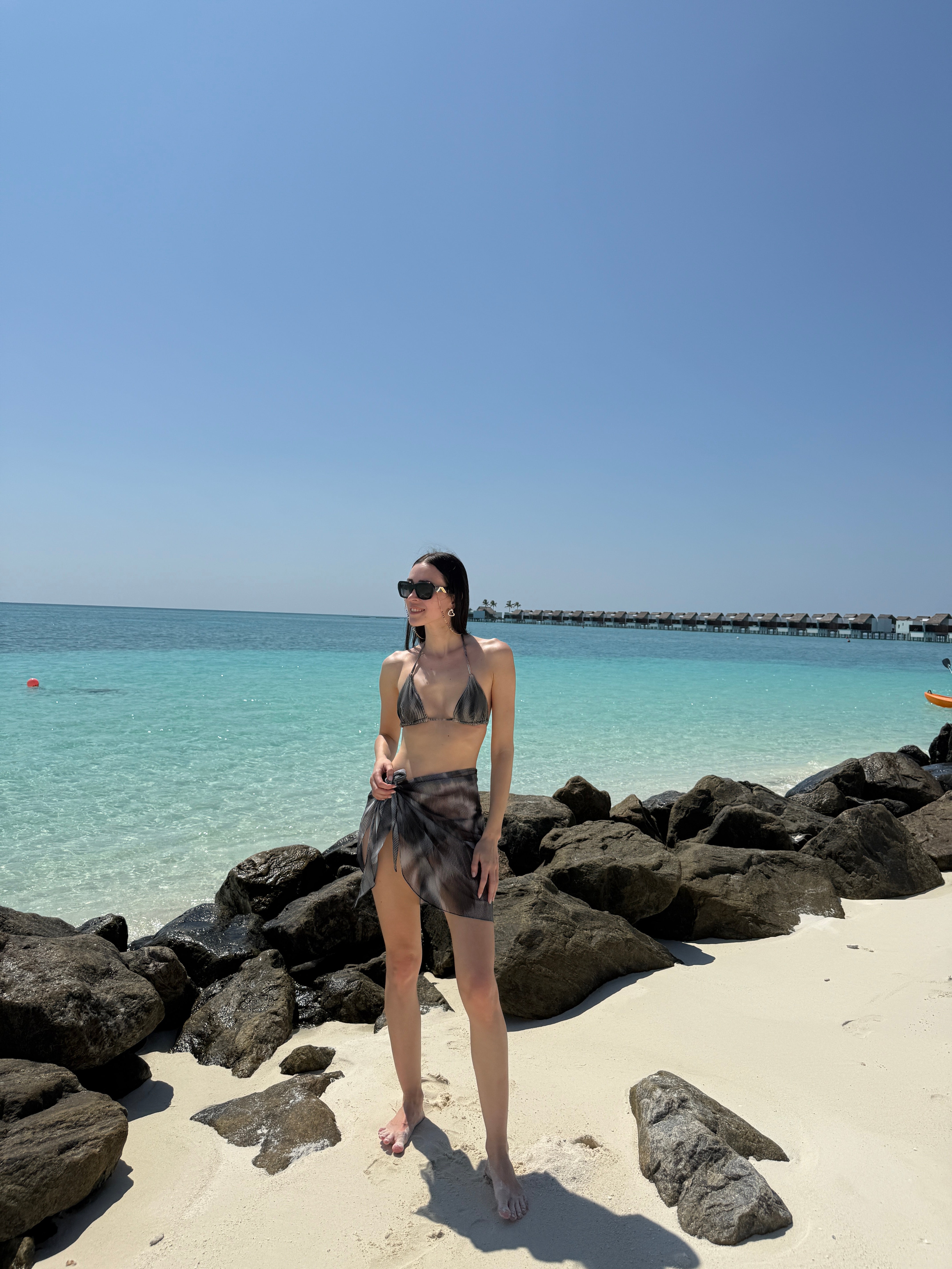 Elvira Jain - Hermione Black Triangle Side Tie 3D Bikini Set - Evita Black Optical Tie Side Sarong | Moeva | Bikini Set | Each week unveils new pieces—luxury swimwear, fluid resort silhouettes, and elevated summer-to-evening essentials designed to carry you from coastal escapes to city nights.