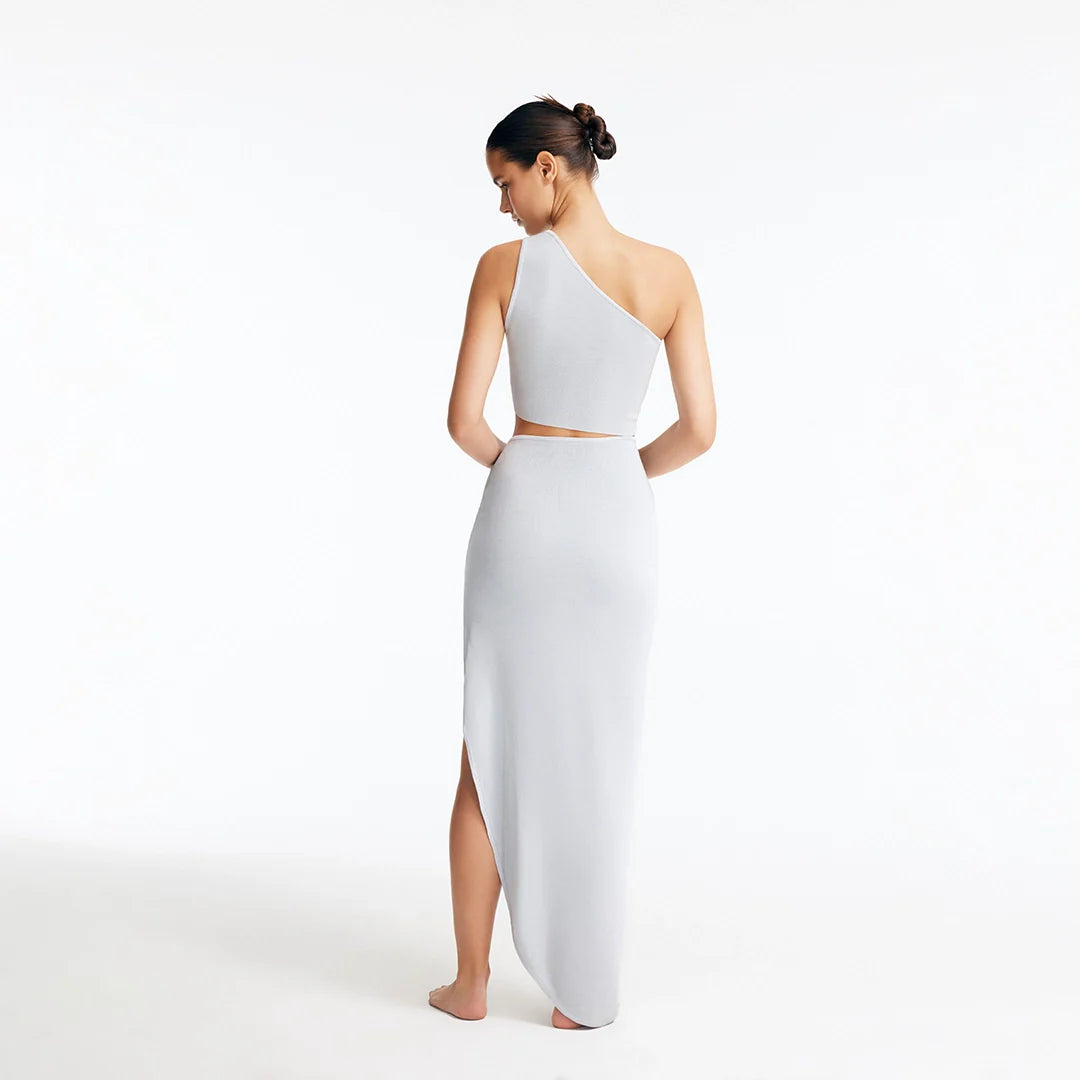 Eila Silver One Shoulder Knitted Crop Top and Lyndon Silver Knitted Skirt with Side Slit | Moeva | Set | Each week unveils new pieces—luxury swimwear, fluid resort silhouettes, and elevated summer-to-evening essentials designed to carry you from coastal escapes to city nights.