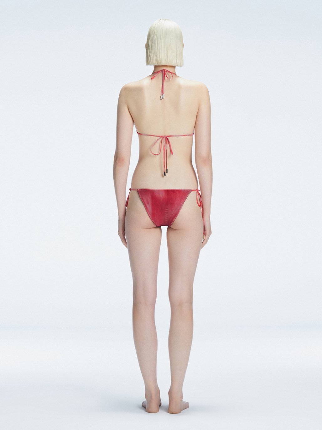 Hermione Red Side Tie 3D Bikini Bottom | Moeva | Bikini Bottom | Each week unveils new pieces—luxury swimwear, fluid resort silhouettes, and elevated summer-to-evening essentials designed to carry you from coastal escapes to city nights.