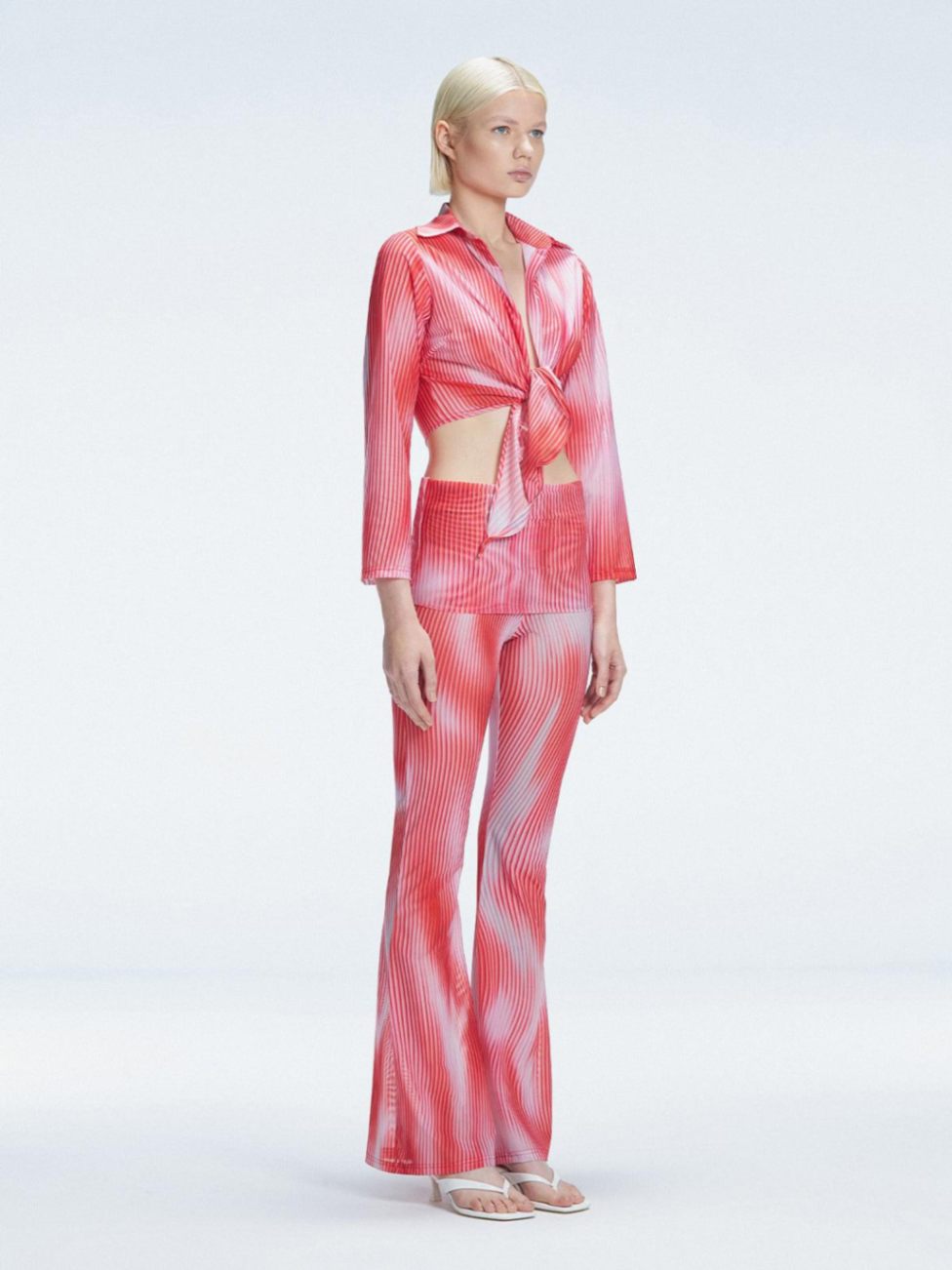 Greta Red Long Sleeve Tie Front Shirt | Moeva | Shirt | Each week unveils new pieces—luxury swimwear, fluid resort silhouettes, and elevated summer-to-evening essentials designed to carry you from coastal escapes to city nights.