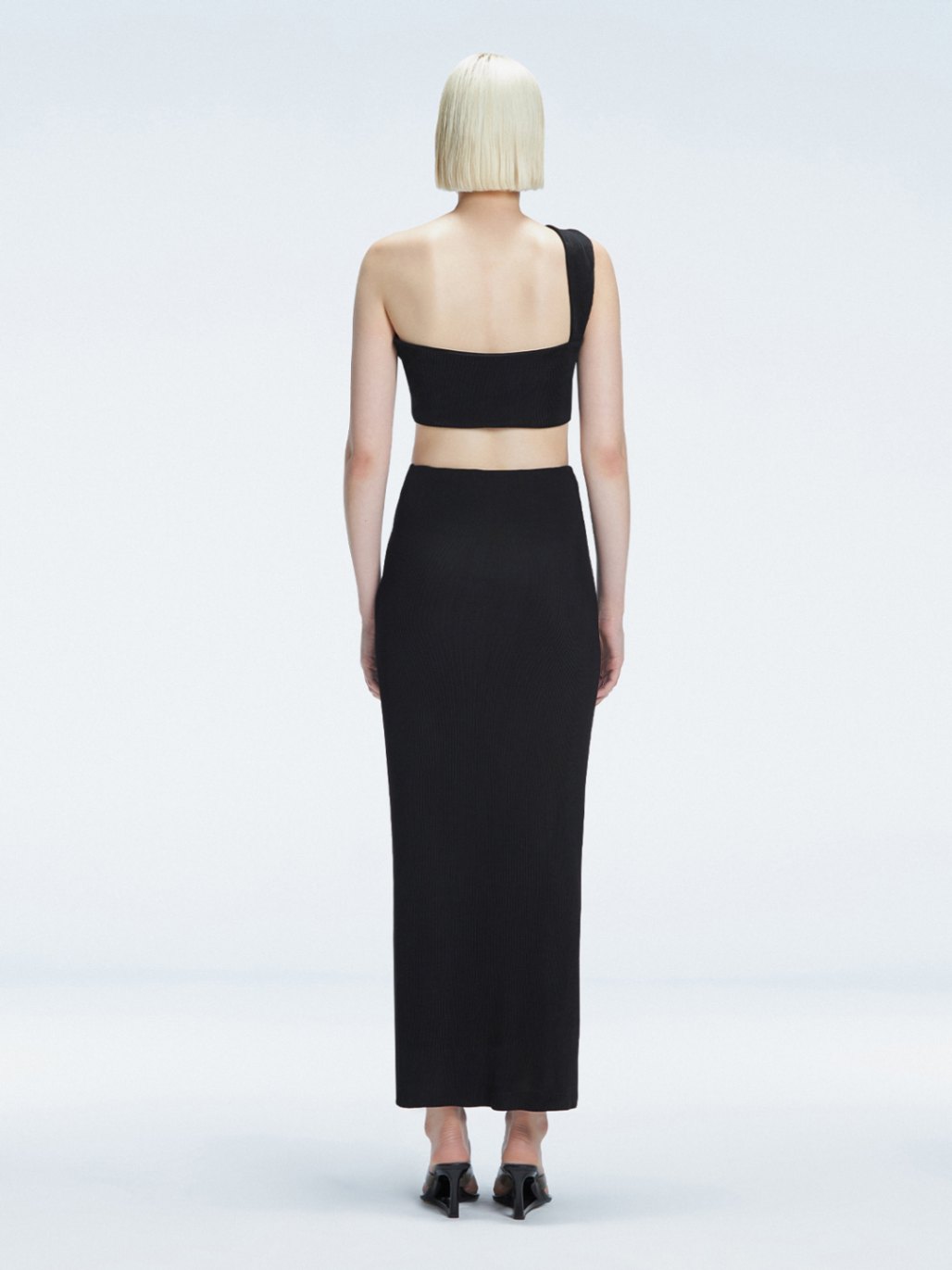Esmeralda Black Maxi Skirt with Front Ruched Detail | Moeva | Skirt | Each week unveils new pieces—luxury swimwear, fluid resort silhouettes, and elevated summer-to-evening essentials designed to carry you from coastal escapes to city nights.