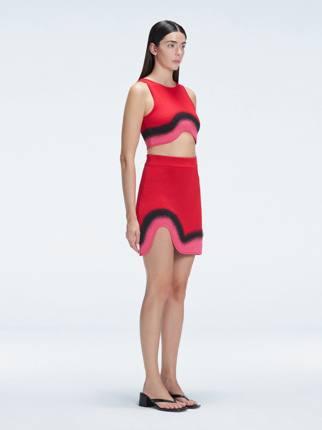 Lydia Red Optical Knit Mini Skirt | Moeva | Skirt | Each week unveils new pieces—luxury swimwear, fluid resort silhouettes, and elevated summer-to-evening essentials designed to carry you from coastal escapes to city nights.