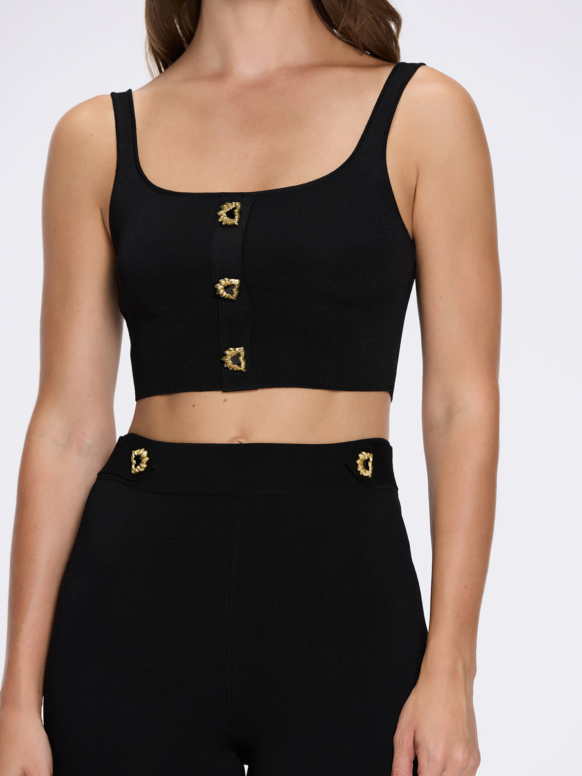 Aureline Black Knitted Scoop Neck Gold Buttoned Crop Top | Moeva | Crop Top | Each week unveils new pieces—luxury swimwear, fluid resort silhouettes, and elevated summer-to-evening essentials designed to carry you from coastal escapes to city nights.