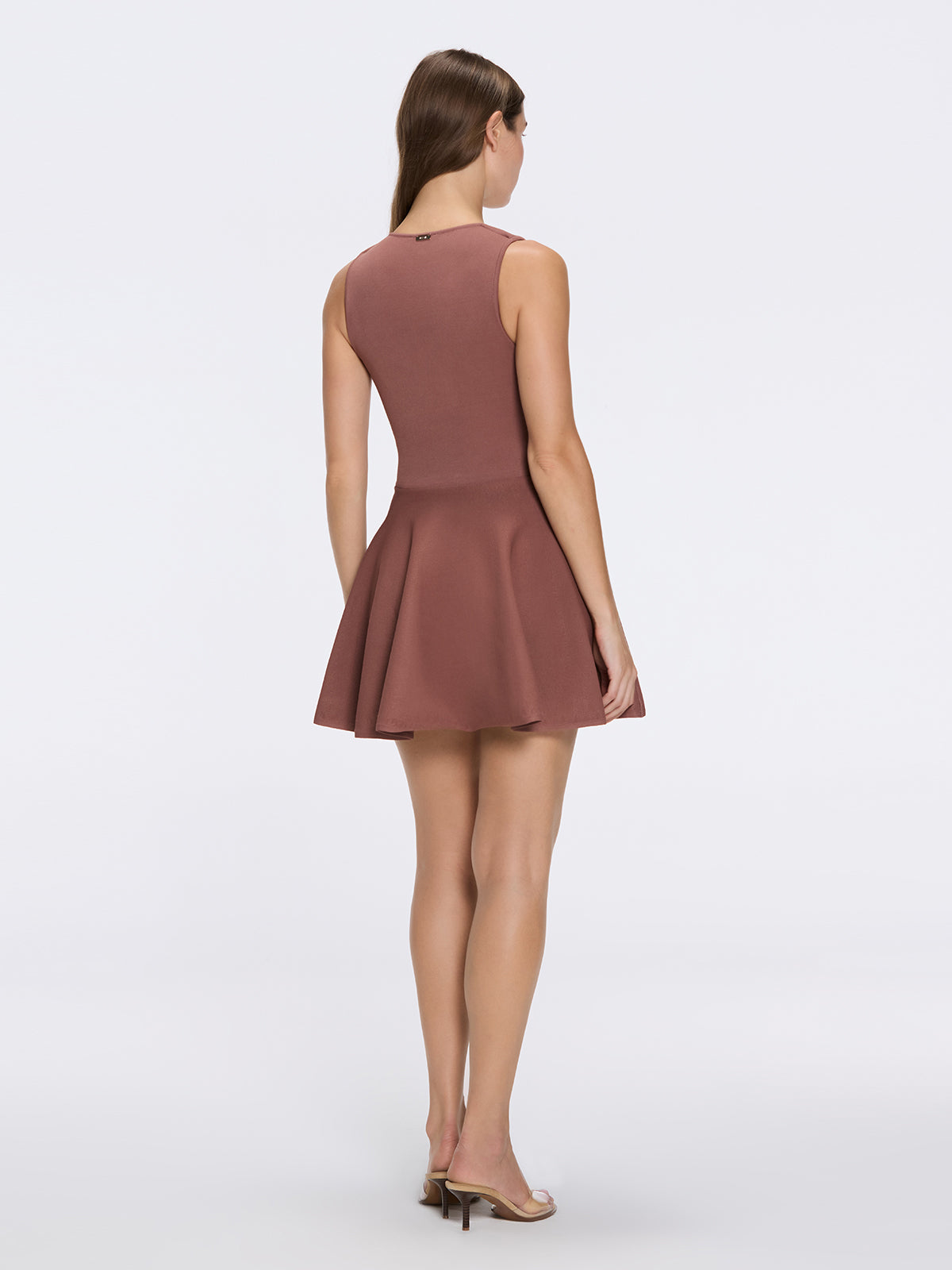Meditara Brown Knit Mini Dress with Flared Skirt and Gold Button Details | Moeva | Dress | Each week unveils new pieces—luxury swimwear, fluid resort silhouettes, and elevated summer-to-evening essentials designed to carry you from coastal escapes to city nights.