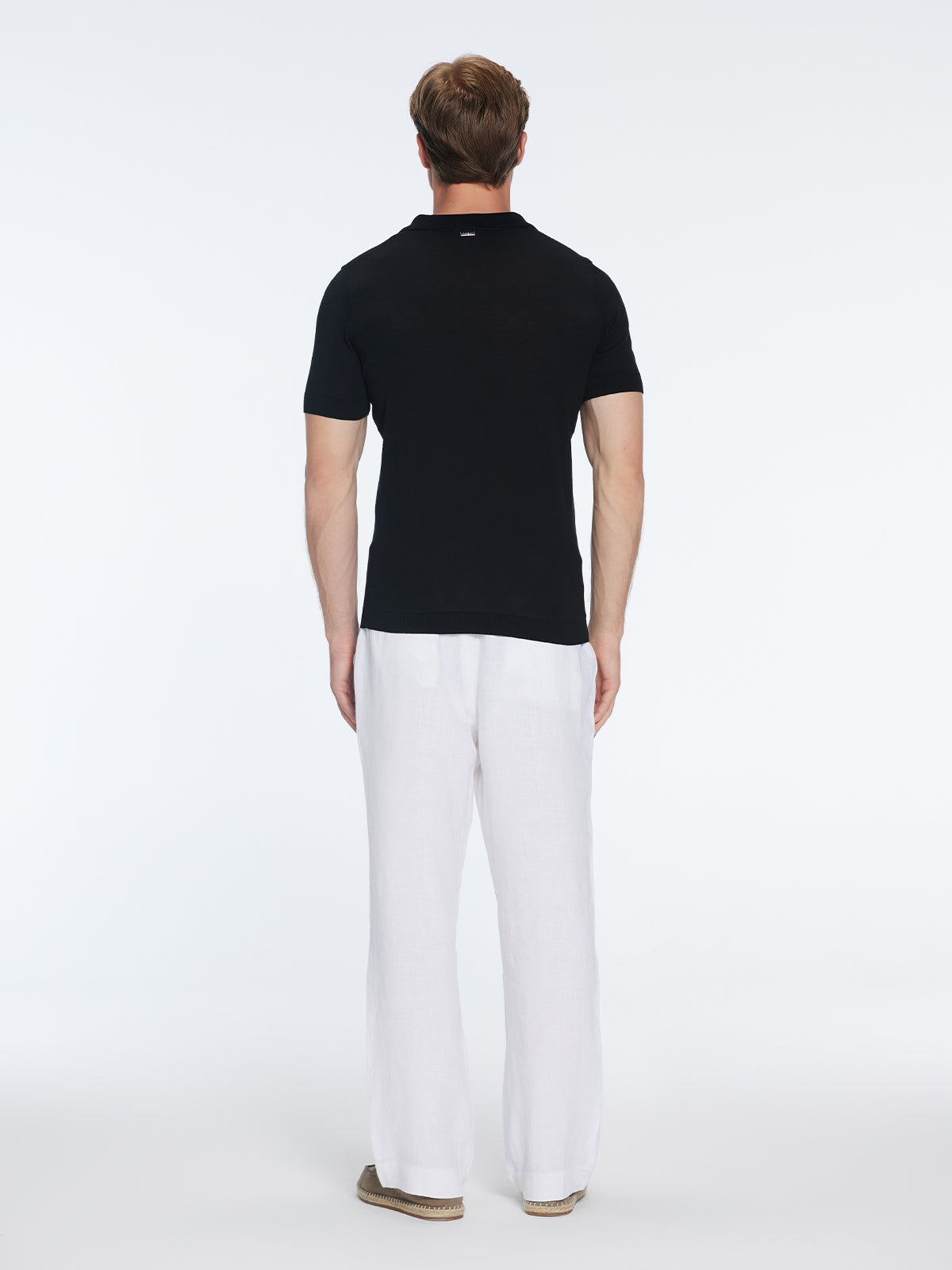 Mark Black Cotton V-Neck Polo T-Shirt | Moeva | T-Shirt | Each week unveils new pieces—luxury swimwear, fluid resort silhouettes, and elevated summer-to-evening essentials designed to carry you from coastal escapes to city nights.