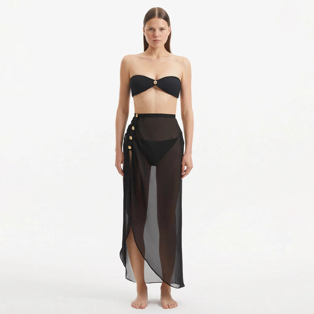 Xander Black Sheer Maxi Skirt with Gold Button Details | Moeva | Skirt | Each week unveils new pieces—luxury swimwear, fluid resort silhouettes, and elevated summer-to-evening essentials designed to carry you from coastal escapes to city nights.