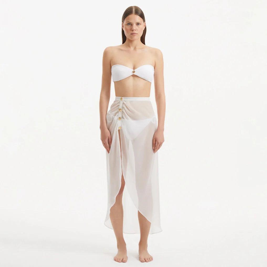 Xander White Sheer Maxi Skirt with Gold Button Details | Moeva | Skirt | Each week unveils new pieces—luxury swimwear, fluid resort silhouettes, and elevated summer-to-evening essentials designed to carry you from coastal escapes to city nights.