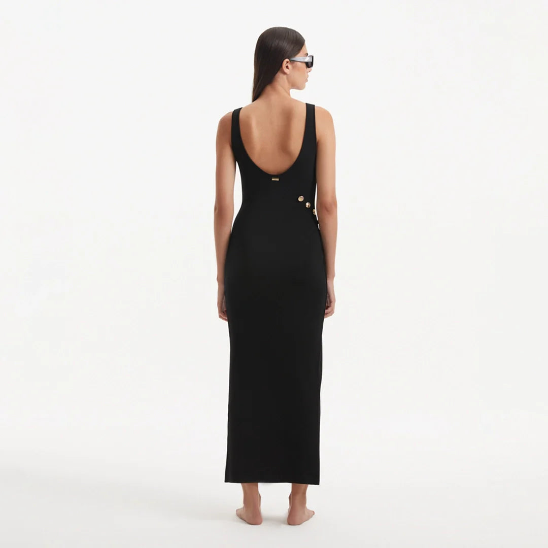 Raine Black Knit Maxi Dress with Side Slit & Button Detail | Moeva | Dress | Each week unveils new pieces—luxury swimwear, fluid resort silhouettes, and elevated summer-to-evening essentials designed to carry you from coastal escapes to city nights.