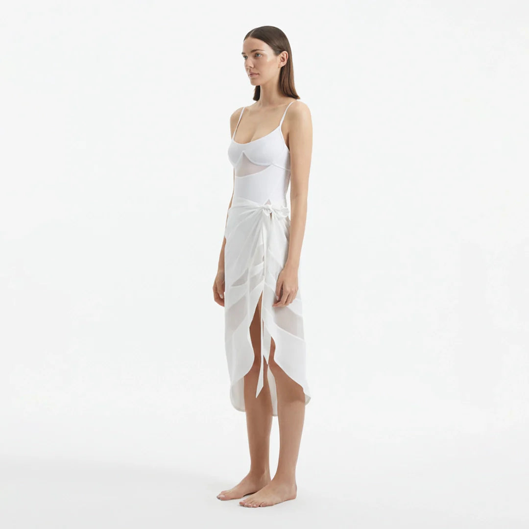 Pelagia White Tie Front Wavy-Trim Sheer Sarong | Moeva | Sarong | Each week unveils new pieces—luxury swimwear, fluid resort silhouettes, and elevated summer-to-evening essentials designed to carry you from coastal escapes to city nights.
