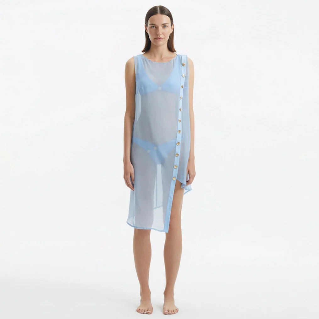 Adora Baby Blue Sheer Sleeveless Asymmetric Dress with Gold Button Detail | Moeva | Dress | Each week unveils new pieces—luxury swimwear, fluid resort silhouettes, and elevated summer-to-evening essentials designed to carry you from coastal escapes to city nights.
