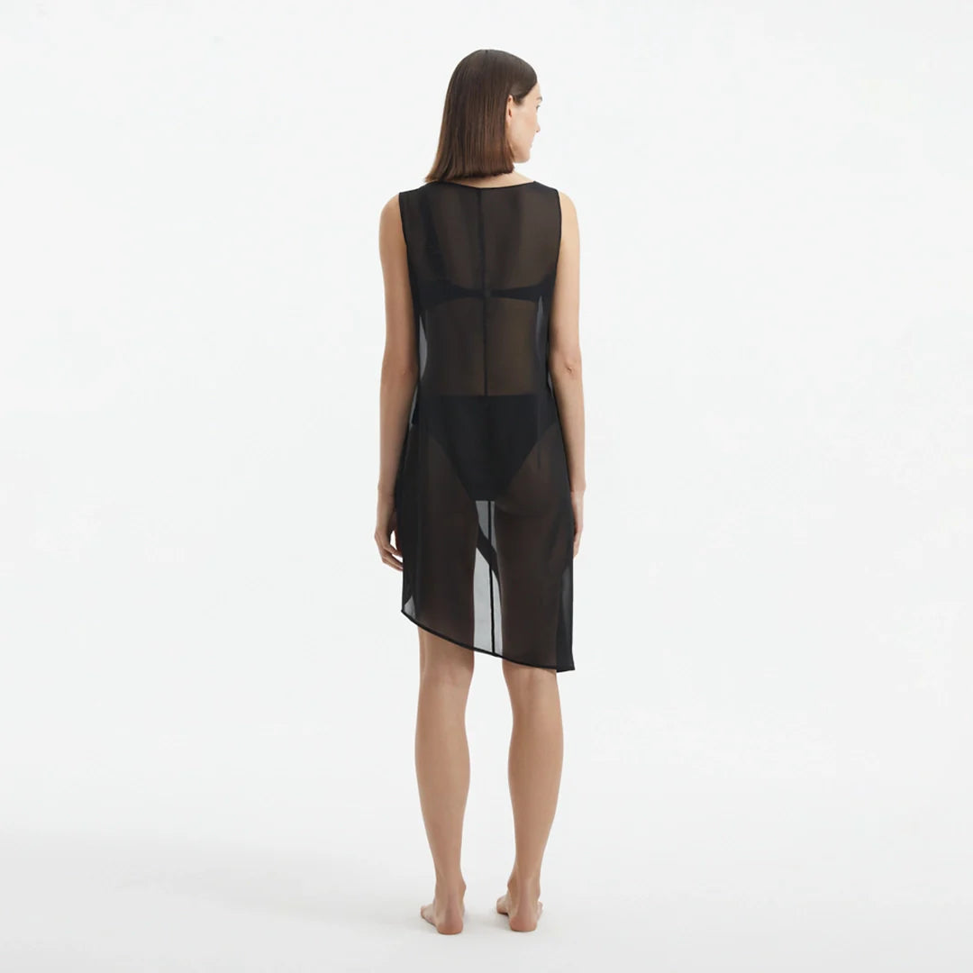 Adora Black Sheer Sleeveless Asymmetric Dress with Gold Button Detail | Moeva | Dress | Each week unveils new pieces—luxury swimwear, fluid resort silhouettes, and elevated summer-to-evening essentials designed to carry you from coastal escapes to city nights.
