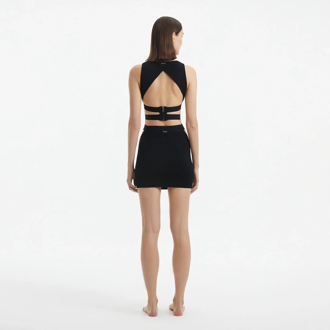 Garda Black Knitted Cut-Out Crop Top | Moeva | Crop Top | Each week unveils new pieces—luxury swimwear, fluid resort silhouettes, and elevated summer-to-evening essentials designed to carry you from coastal escapes to city nights.