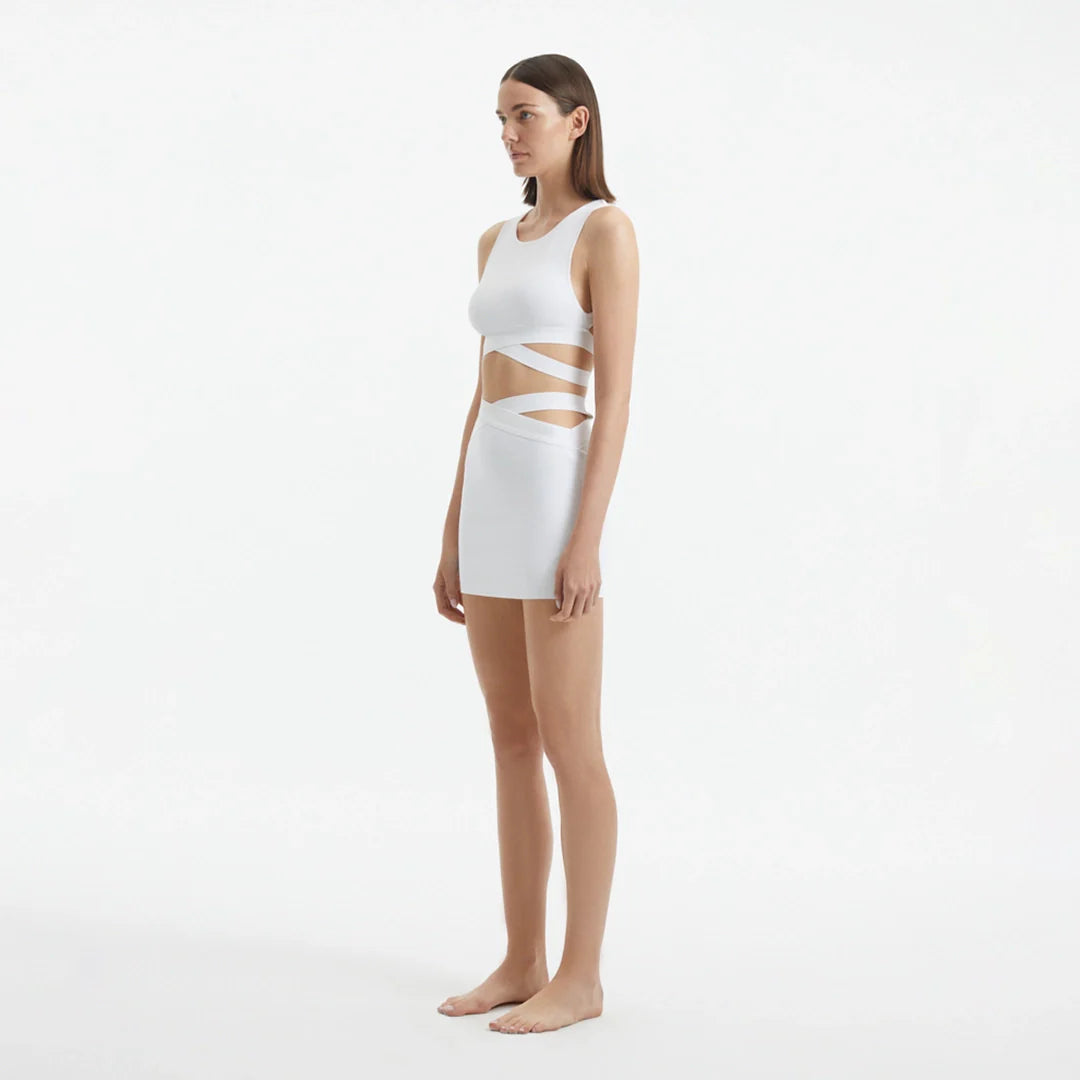 Garda White Knitted Cut-Out Crop Top | Moeva | Crop Top | Each week unveils new pieces—luxury swimwear, fluid resort silhouettes, and elevated summer-to-evening essentials designed to carry you from coastal escapes to city nights.