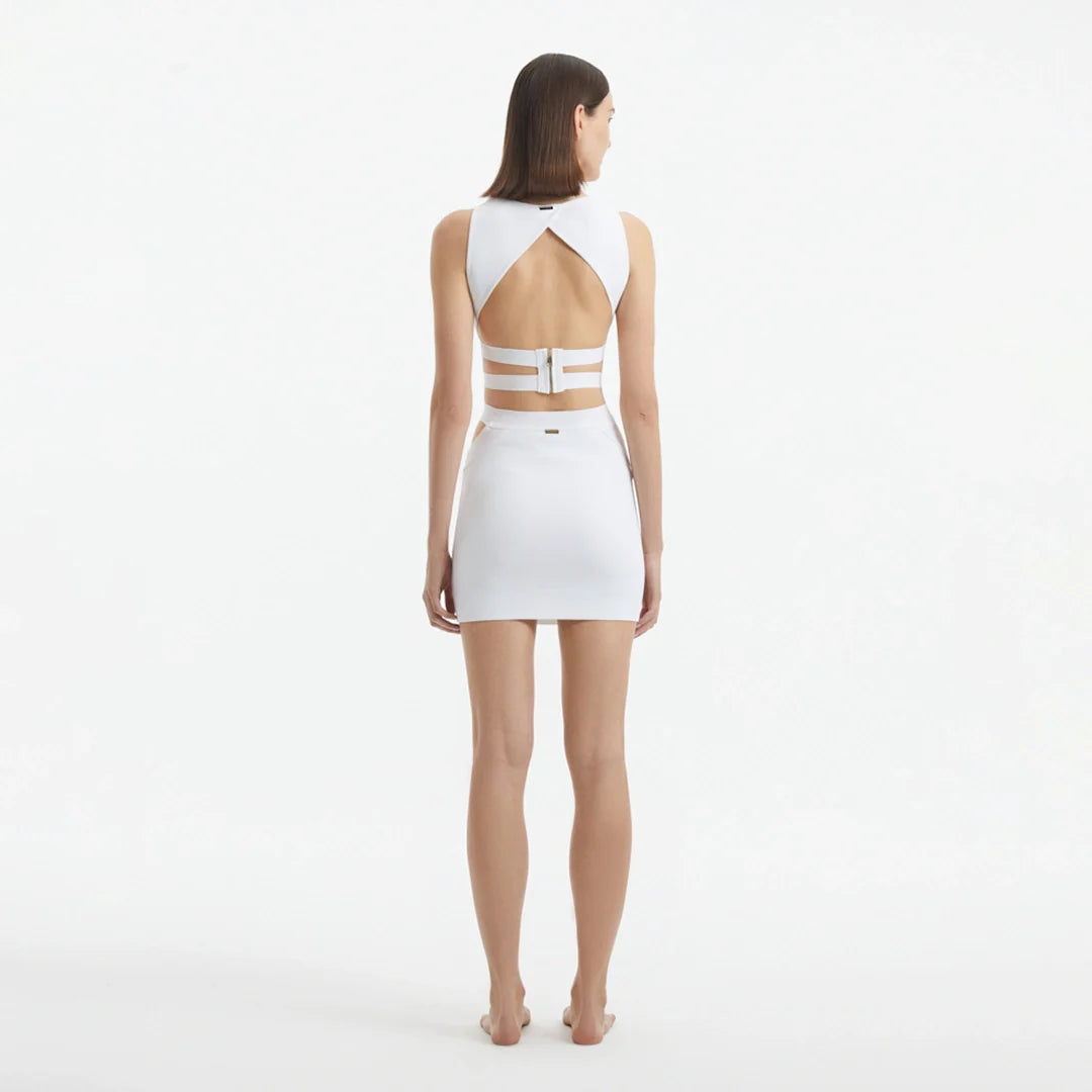 Garda White Knitted Cut-Out Crop Top | Moeva | Crop Top | Each week unveils new pieces—luxury swimwear, fluid resort silhouettes, and elevated summer-to-evening essentials designed to carry you from coastal escapes to city nights.