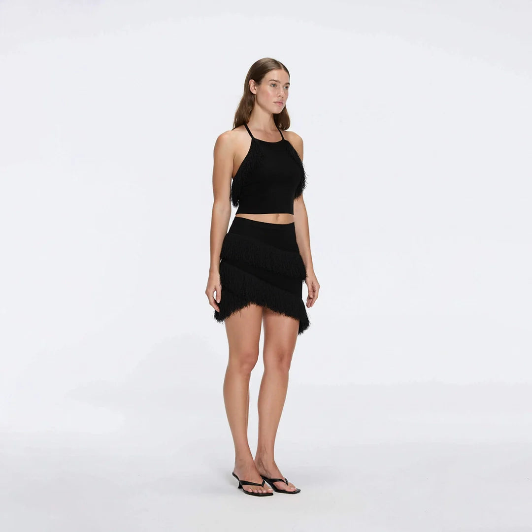 Arlo Black Fringe Detail Asymmetric Mini Skirt | Moeva | Skirt | Each week unveils new pieces—luxury swimwear, fluid resort silhouettes, and elevated summer-to-evening essentials designed to carry you from coastal escapes to city nights.