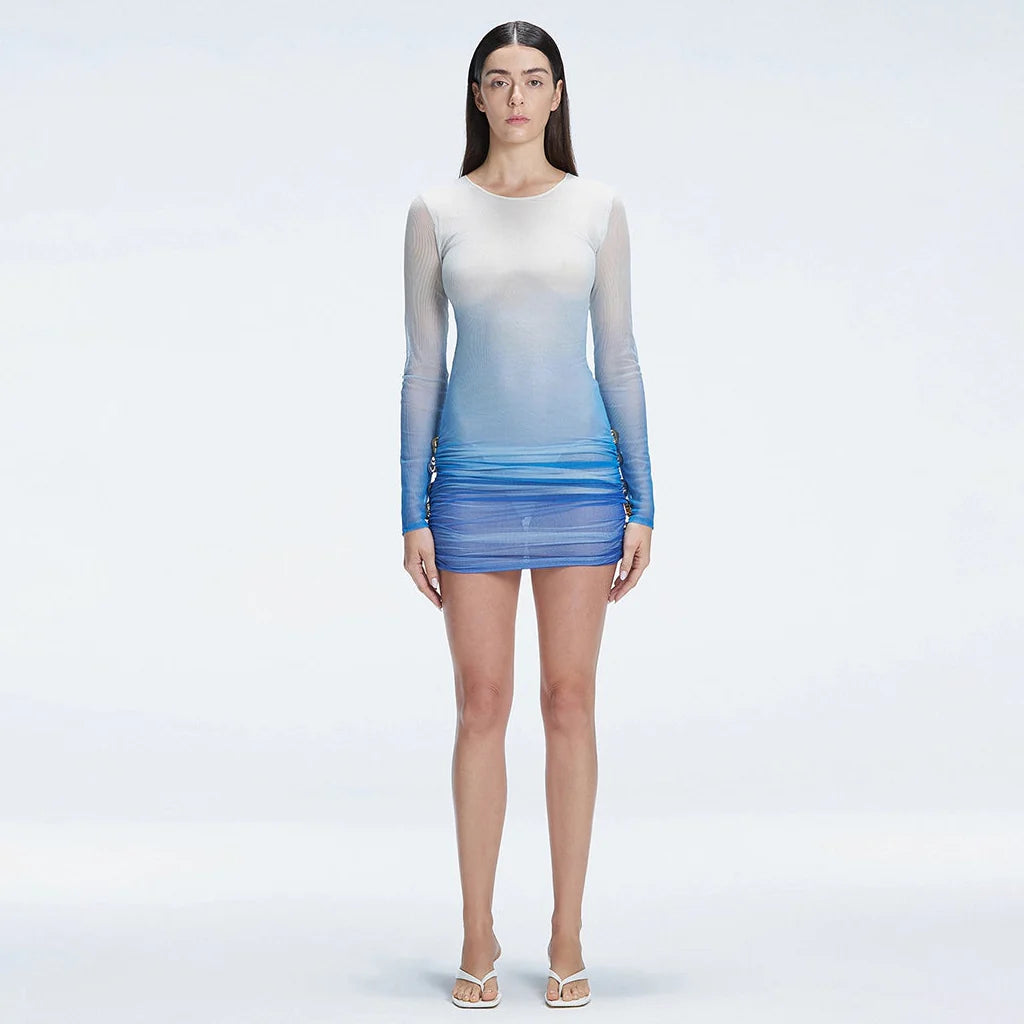 Sylvie Blue Optical Long Sleeve Mini Dress | Moeva | Dress | Each week unveils new pieces—luxury swimwear, fluid resort silhouettes, and elevated summer-to-evening essentials designed to carry you from coastal escapes to city nights.