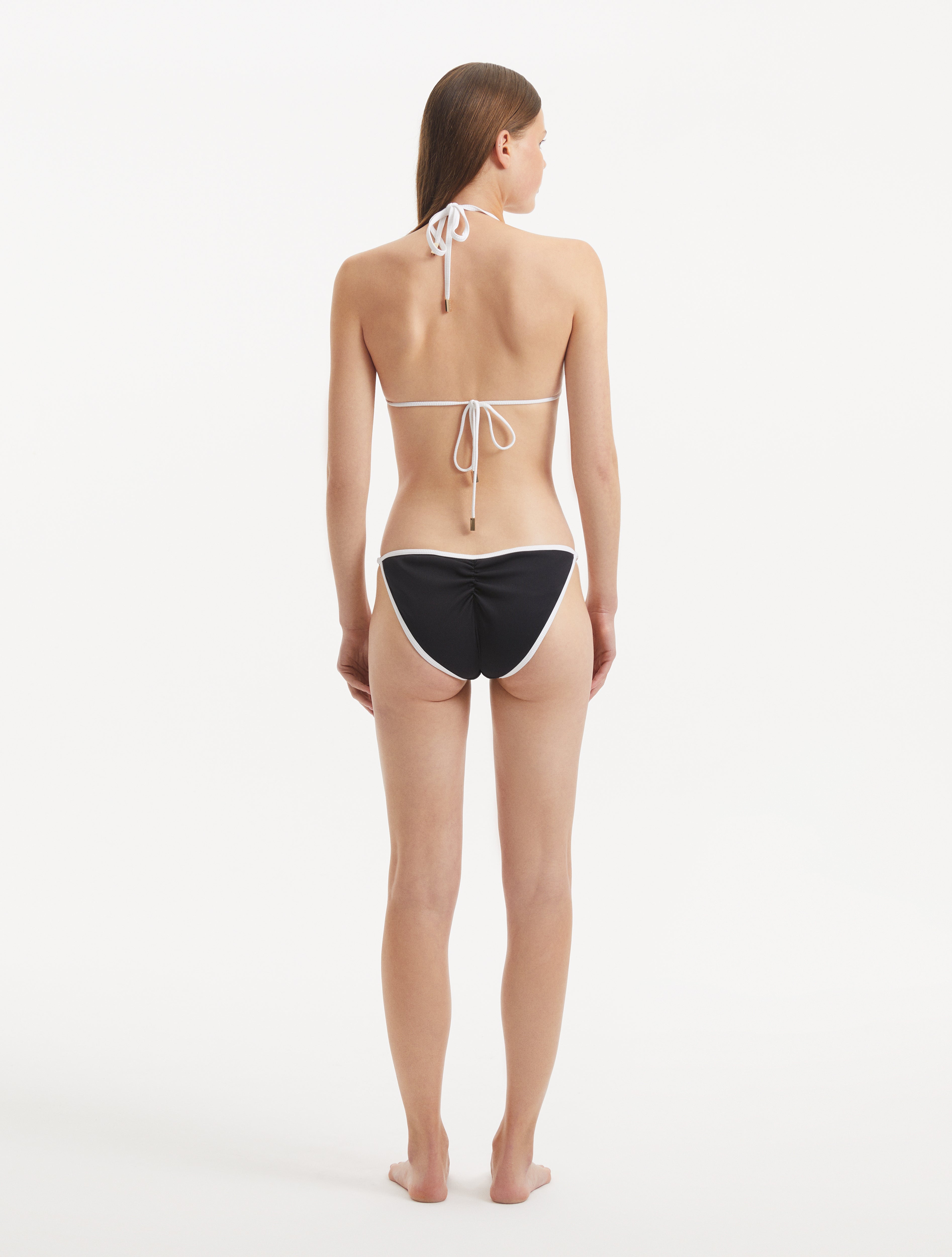 Zarya Black Triangle Textured Mid Coverage Bikini Set | Moeva | Bikini Set | Each week unveils new pieces—luxury swimwear, fluid resort silhouettes, and elevated summer-to-evening essentials designed to carry you from coastal escapes to city nights.