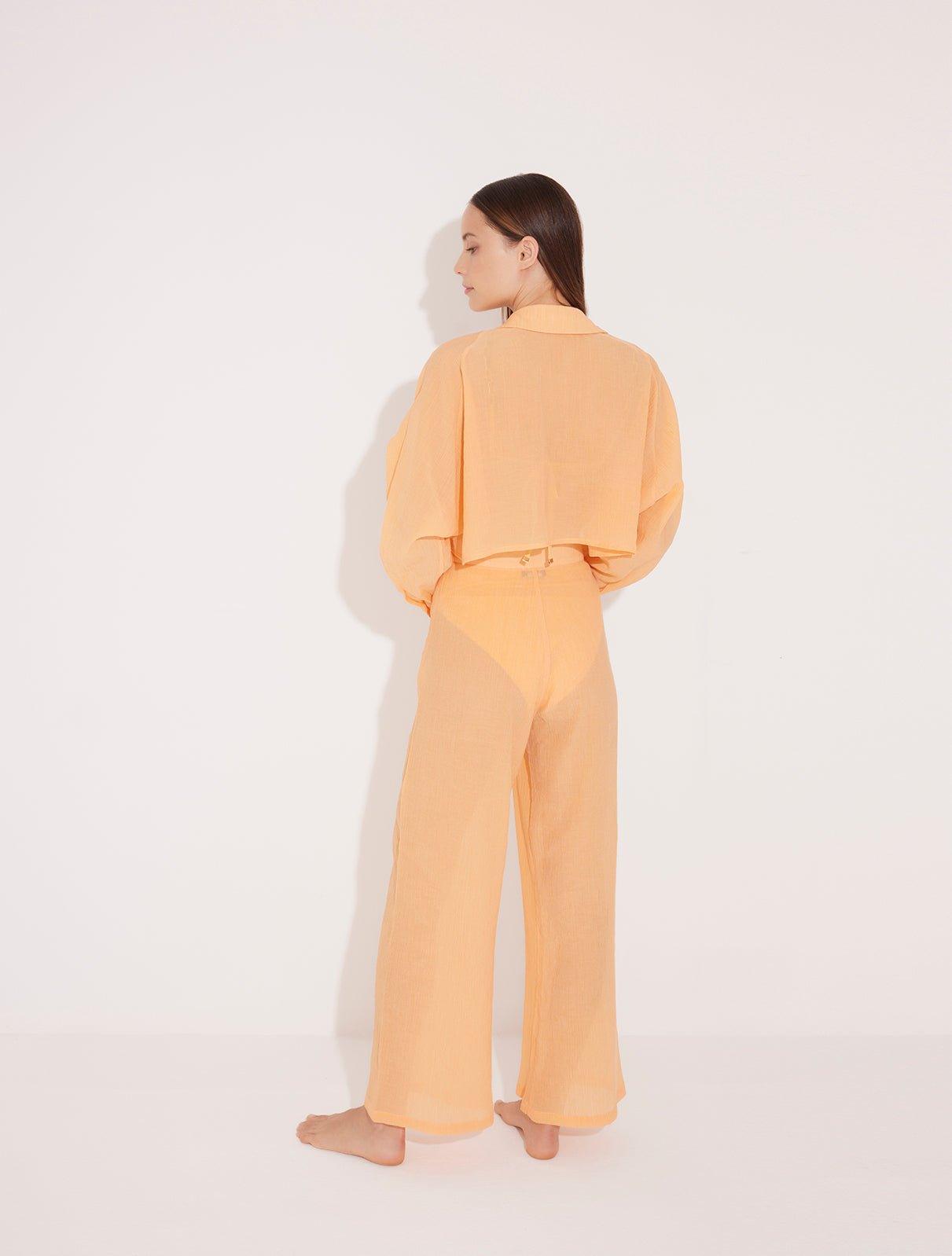 Jacinta Orange Cropped Sheer Long Sleeve Shirt and Aura Orange High Waist Beach Pants | Moeva | Shirt and Pants | Each week unveils new pieces—luxury swimwear, fluid resort silhouettes, and elevated summer-to-evening essentials designed to carry you from coastal escapes to city nights.