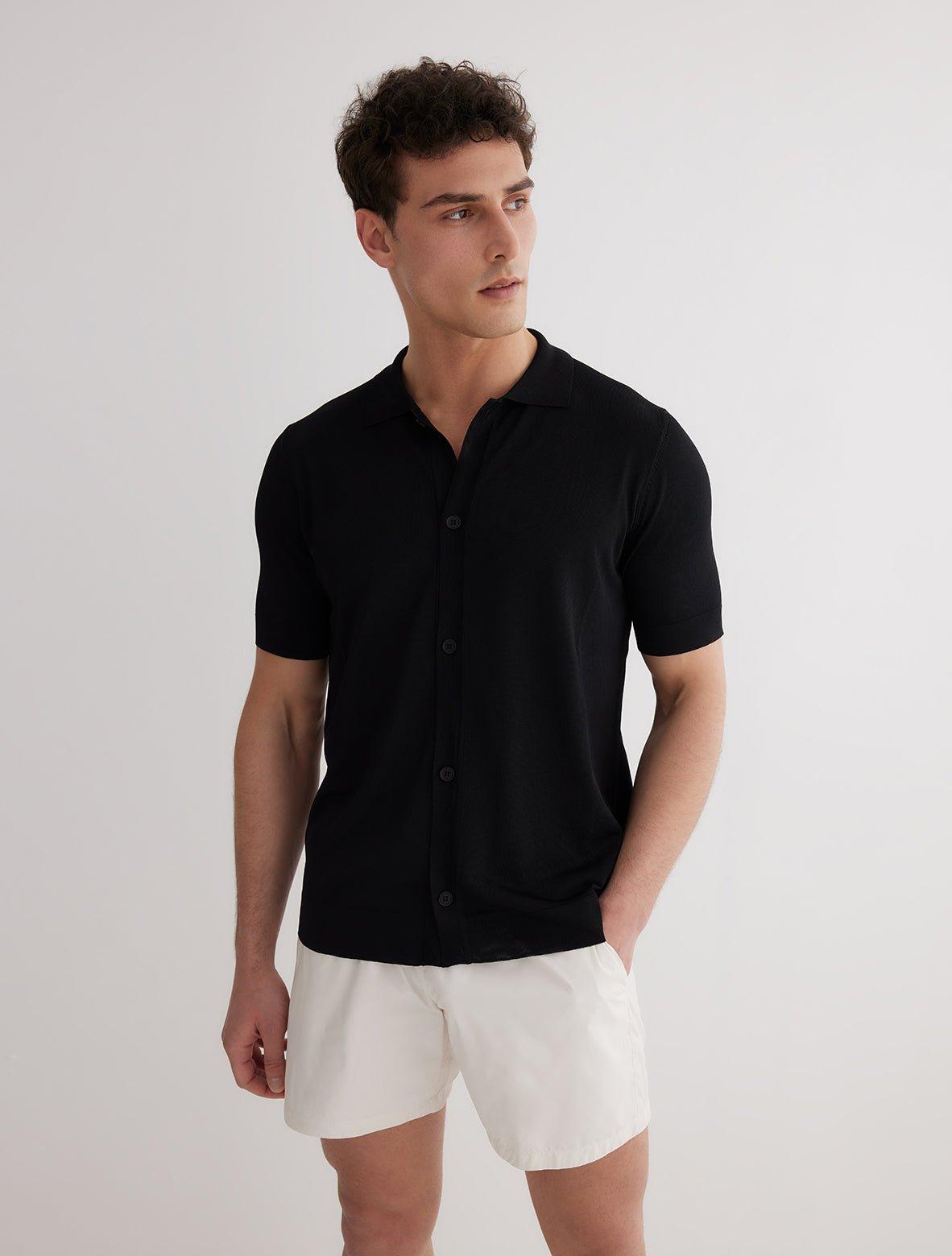 Lars Black Polo Shirt with Button Fastening | Moeva | T-Shirt | Each week unveils new pieces—luxury swimwear, fluid resort silhouettes, and elevated summer-to-evening essentials designed to carry you from coastal escapes to city nights.