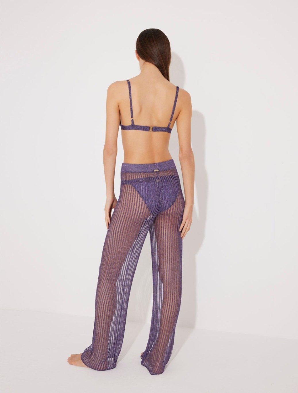 Valentina Marzullo - Hartley Scoop Neck Metallic Knitted Swimsuit & Luz Lilac Metallic Sheer Knit Pants | Moeva | Pants | Each week unveils new pieces—luxury swimwear, fluid resort silhouettes, and elevated summer-to-evening essentials designed to carry you from coastal escapes to city nights.