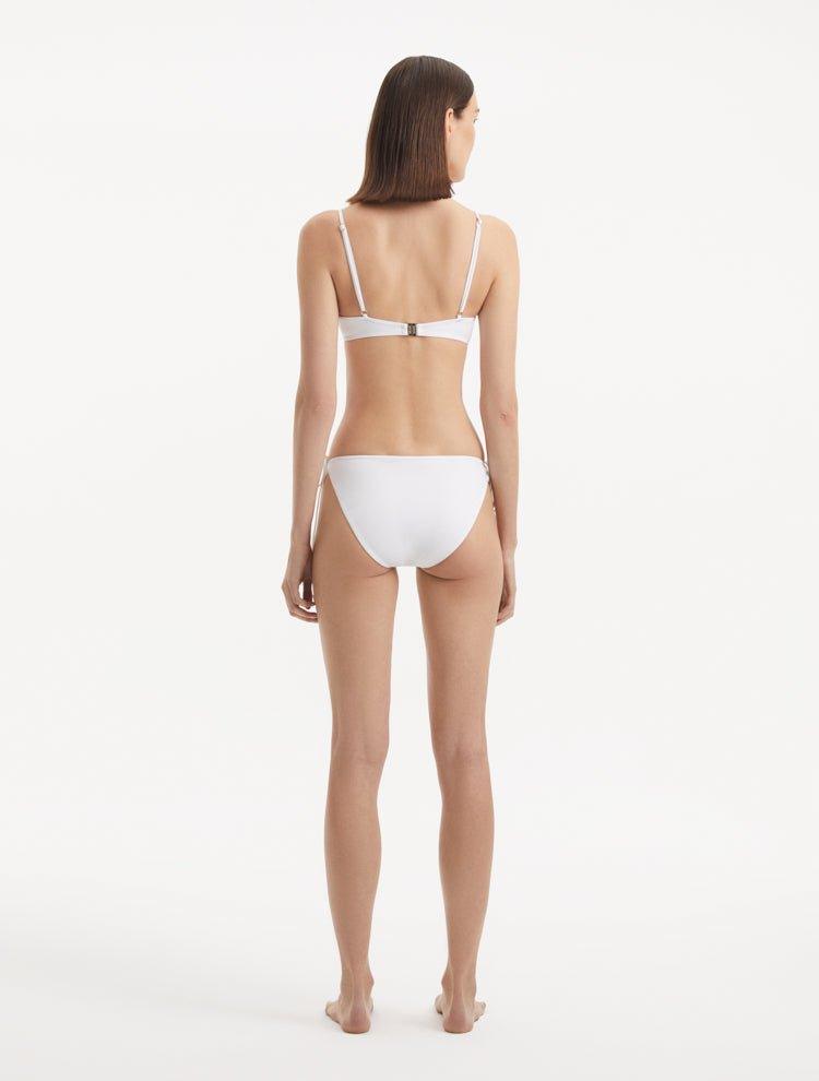 Salila White Side Tie Wave Textured Bikini Bottom | Moeva | Bikini Bottom | Each week unveils new pieces—luxury swimwear, fluid resort silhouettes, and elevated summer-to-evening essentials designed to carry you from coastal escapes to city nights.